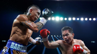 Pacquiao held to draw by Barrios in world title return