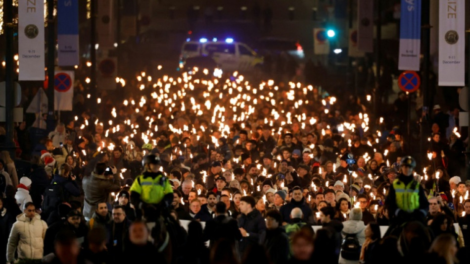 Venezuelans divided on Machado peace prize, return home
