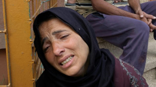 Gaza air strikes kill 94 as manhunt unfolds in West Bank