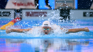 Sleepless in Singapore: Marchand wins gold, day after world record