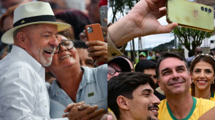 Pr&eacute;sidentielle au Br&eacute;sil: pour sa derni&egrave;re bataille, Lula affronte le fils Bolsonaro