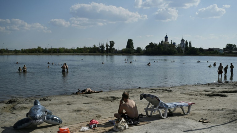 War-weary Ukrainians find solace by frontline lake