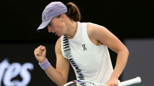 Swiatek survives scare to make Australian Open second round 