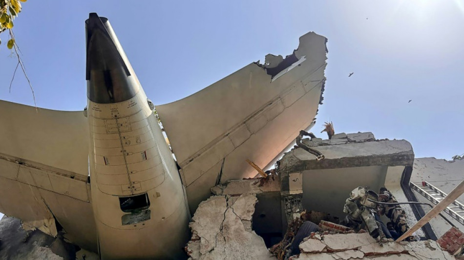 Flames and smoke in aftermath of crashed India passenger jet