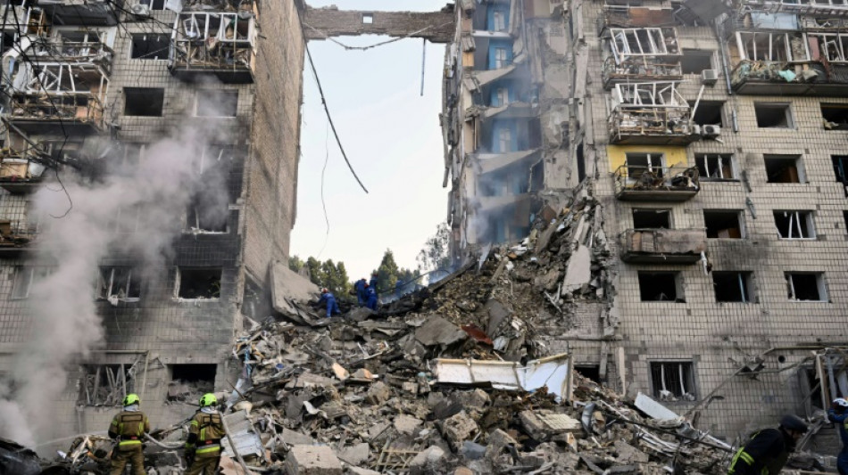 Russian strikes kill 14 in 'horrific' attack on Kyiv 