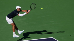 Djokovic battles back to win Indian Wells opener
