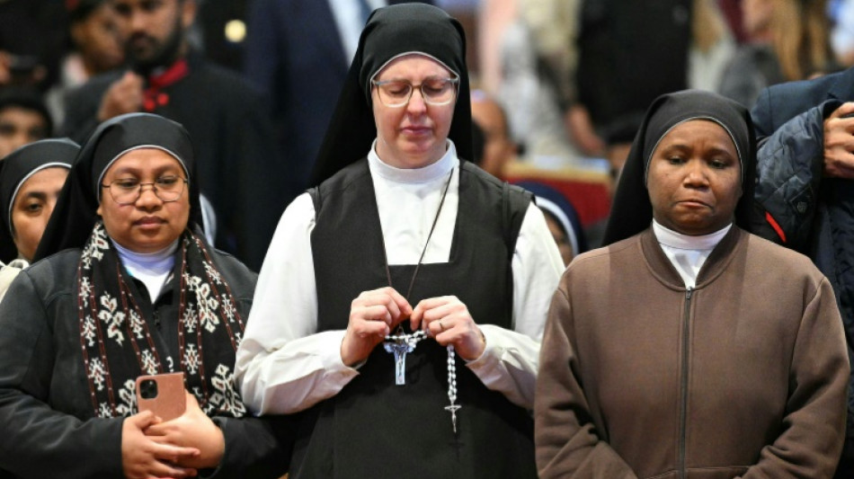 Multitudes line up for second day to view pope