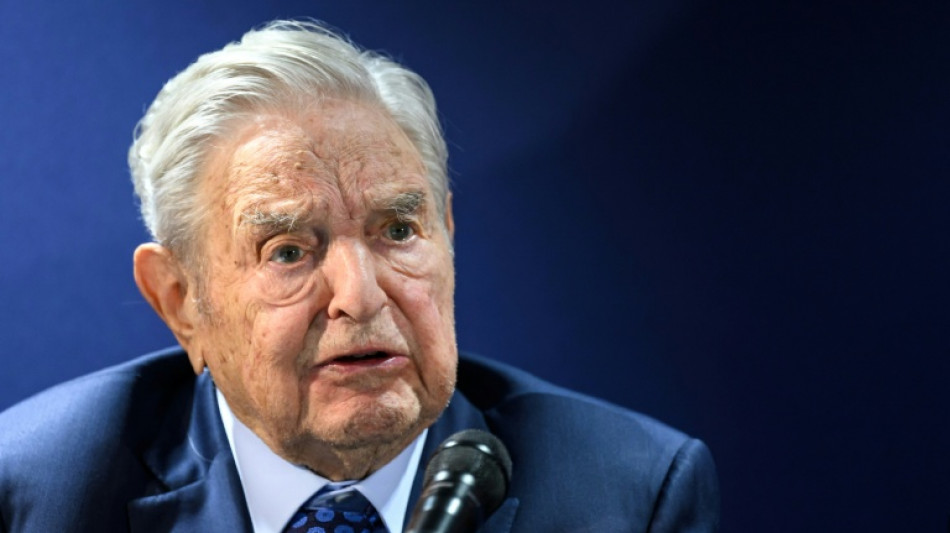 Trump urges criminal charges against George Soros, son