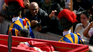 Pilgrims flock to pay tribute to pope lying in state