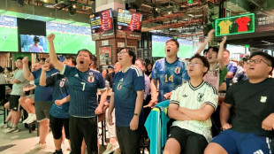 Fans in China put politics aside to cheer Japan at World Cup