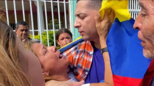Tears of joy as Venezuelan migrants return from El Salvador prison 'hell'