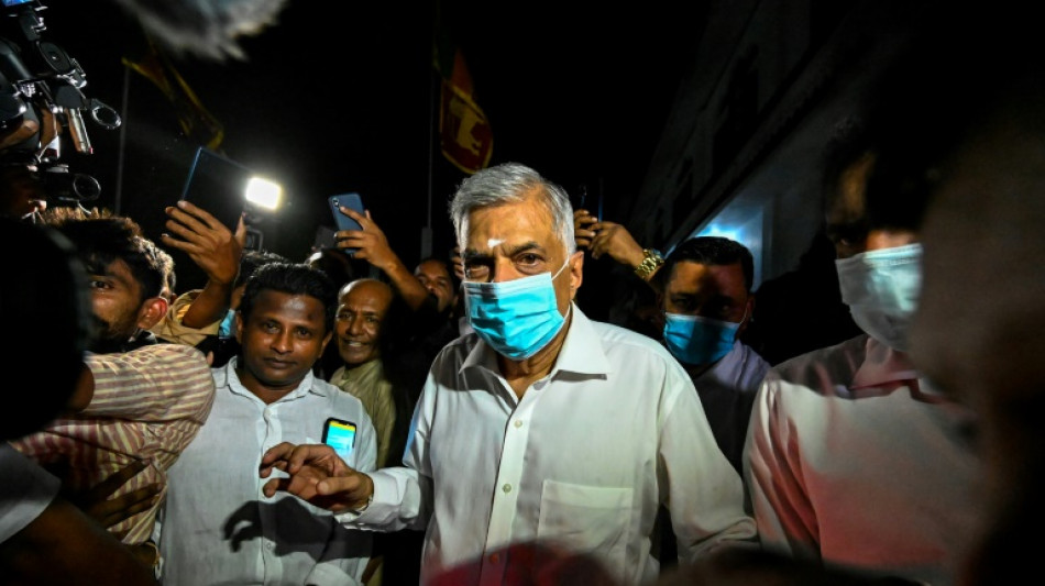 Sri Lanka's new PM struggles to form unity government